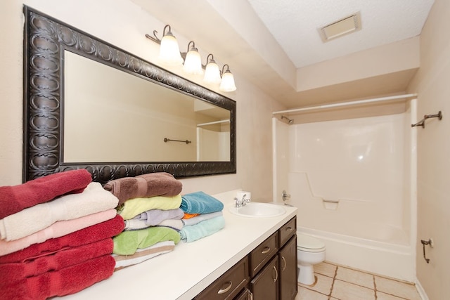 full bathroom with shower / bathing tub combination, toilet, vanity, tile patterned floors, and a textured ceiling