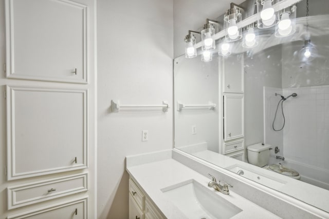 full bathroom with tiled shower / bath, toilet, and vanity