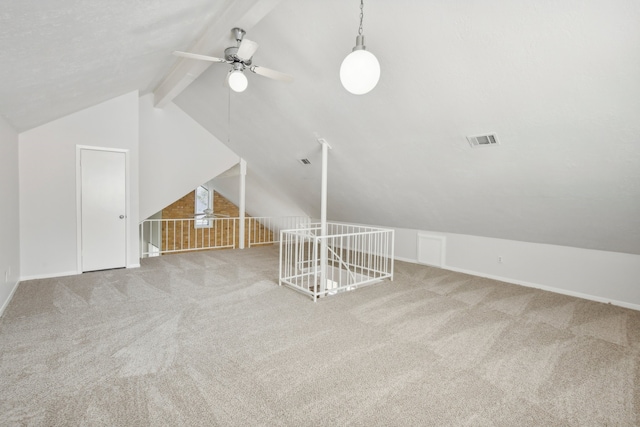 additional living space featuring carpet flooring, ceiling fan, and vaulted ceiling with beams