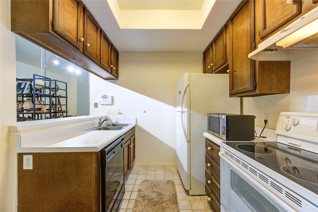 kitchen with black dishwasher, light tile patterned flooring, sink, and electric range