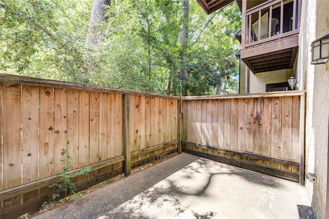 view of patio featuring a balcony