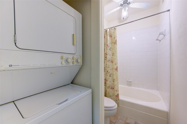 laundry area featuring ceiling fan and stacked washer and dryer