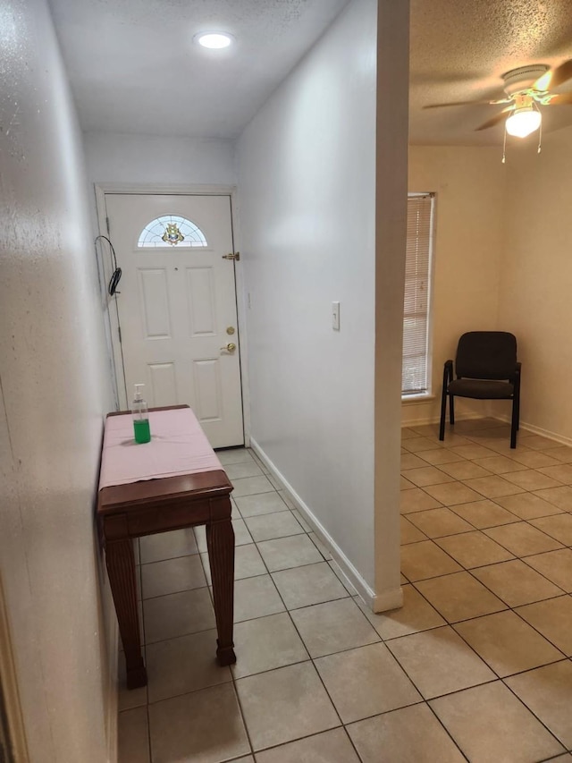 235 W Tri Oaks Ln Unit 235, Houston, TX 77043 - foyer entrance with light tile patterned floors, ceiling fan, recessed lighting, and a textured ceiling