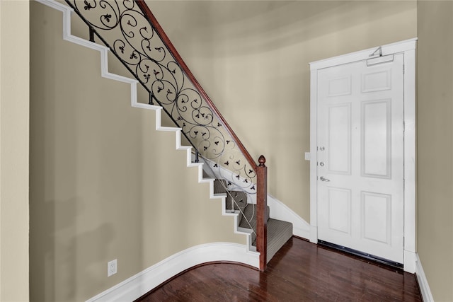 entryway with hardwood / wood-style flooring