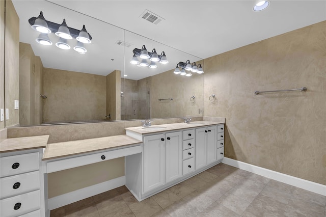 bathroom featuring double vanity and tile patterned floors