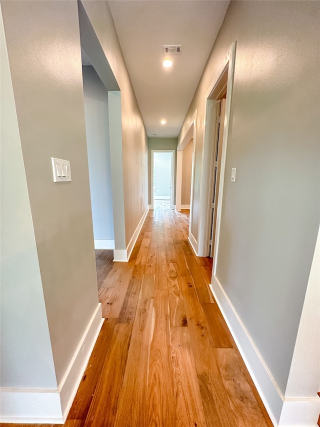 hallway featuring light hardwood / wood-style flooring