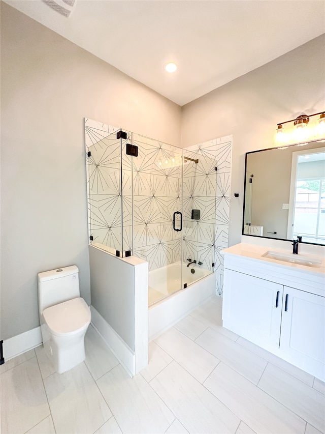 bathroom featuring toilet, tile patterned flooring, and vanity