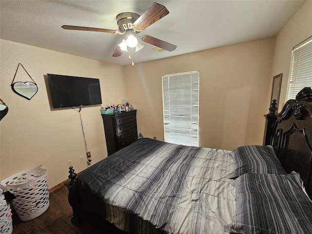 bedroom with ceiling fan and hardwood / wood-style floors