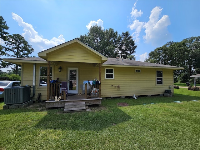 back of property featuring a lawn