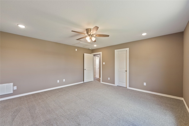 empty room with ceiling fan and carpet flooring