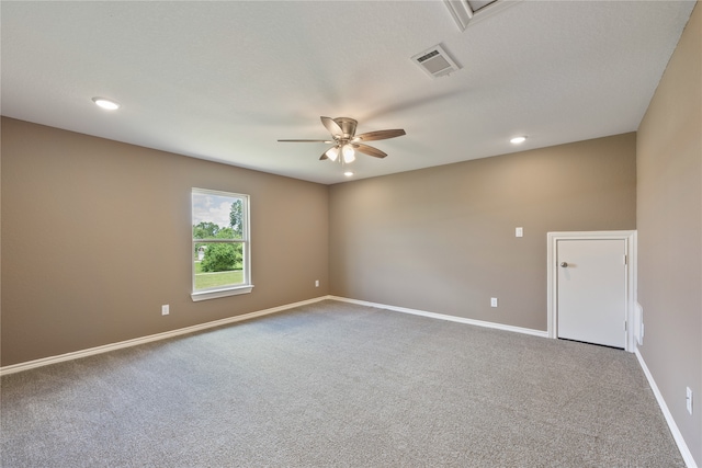 empty room featuring carpet floors and ceiling fan