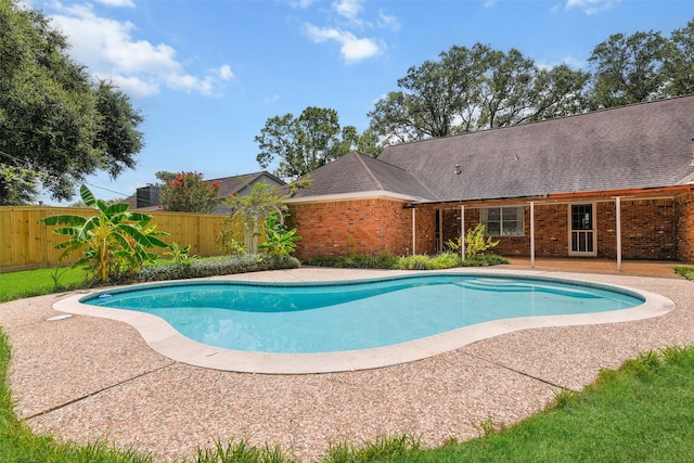 view of swimming pool featuring a patio area