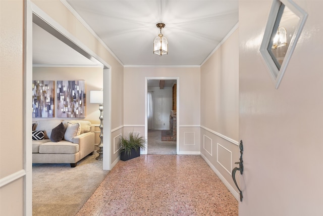 foyer featuring crown molding