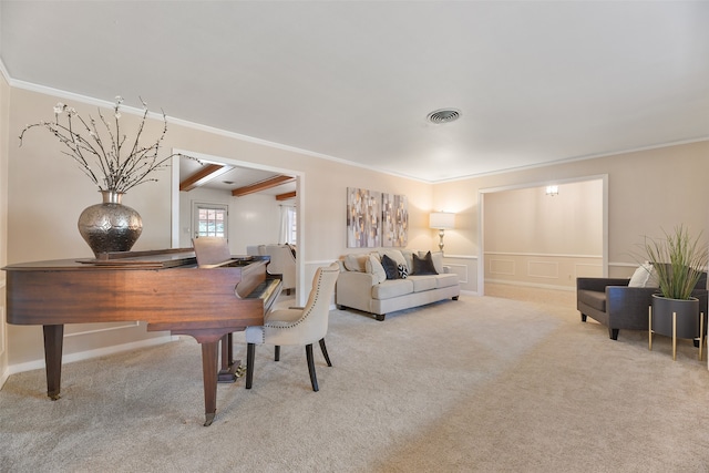 living room featuring light colored carpet, ornamental molding, and beam ceiling