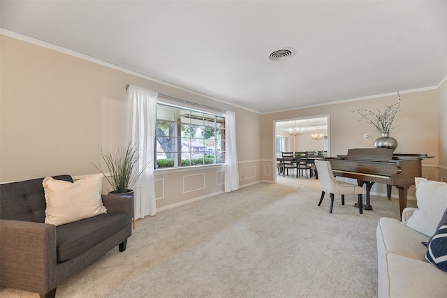 sitting room featuring ornamental molding, an inviting chandelier, and light colored carpet