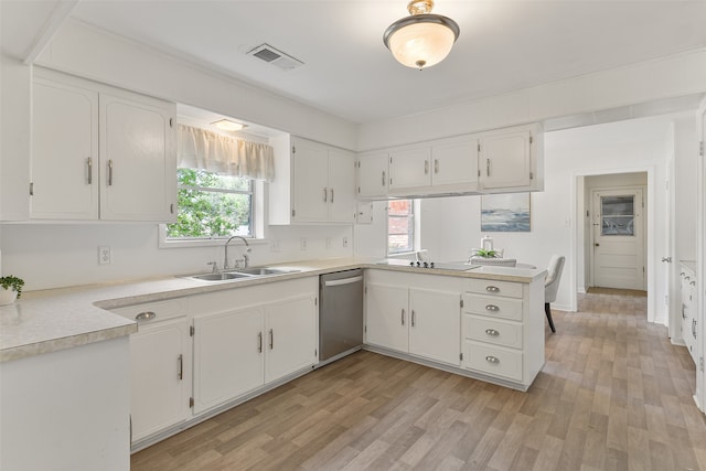 kitchen featuring white cabinetry and sink