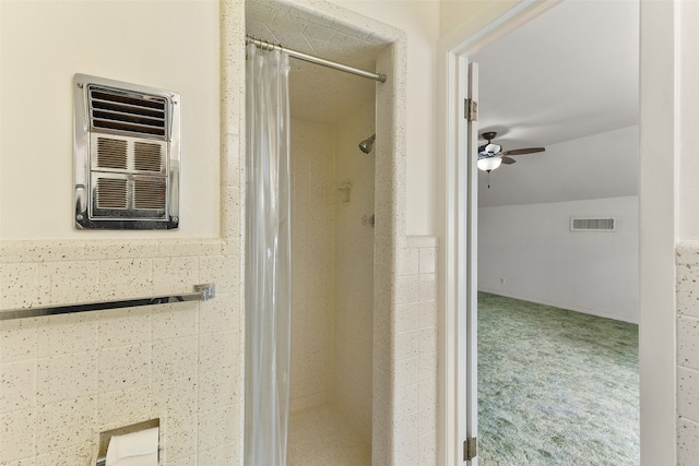 bathroom with ceiling fan and a wall mounted air conditioner