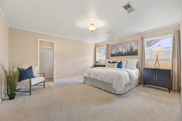 bedroom with ornamental molding, ceiling fan, and light colored carpet