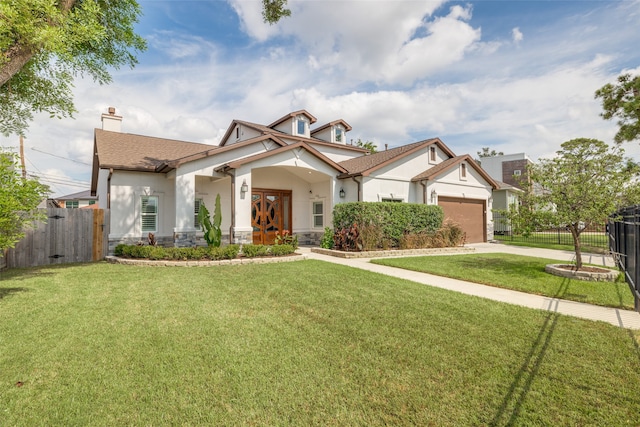 craftsman-style house featuring a garage and a front yard