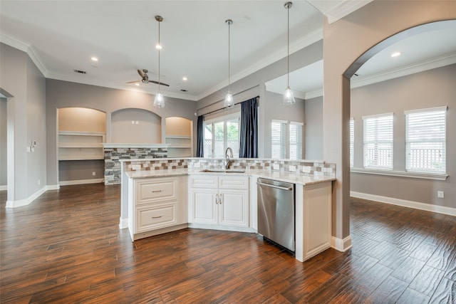 kitchen featuring ceiling fan, stainless steel dishwasher, crown molding, and dark hardwood / wood-style floors