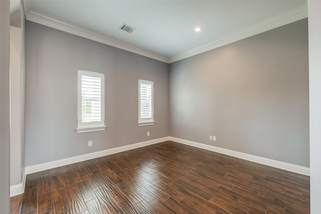 spare room with hardwood / wood-style flooring and ornamental molding