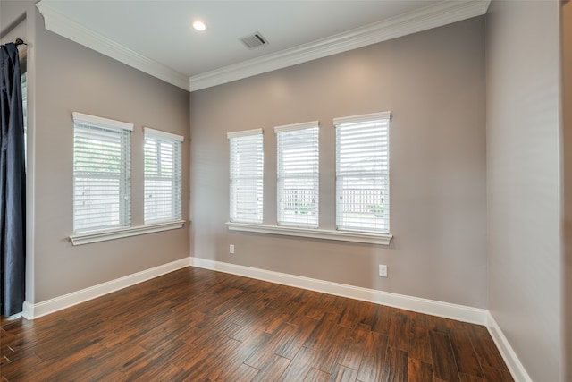 empty room featuring crown molding and hardwood / wood-style floors