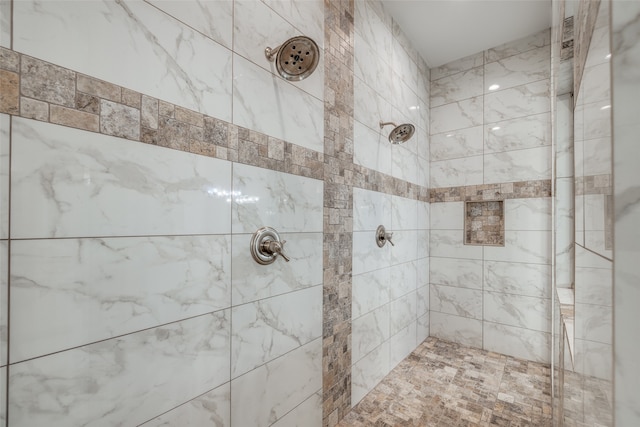 bathroom featuring tiled shower