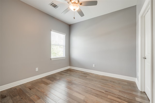 spare room featuring ceiling fan and wood-type flooring