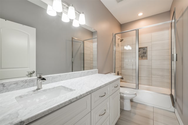 full bathroom with tile patterned flooring, toilet, vanity, and enclosed tub / shower combo