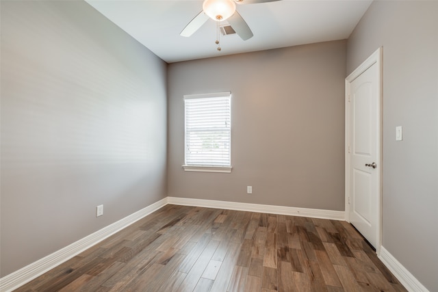 empty room with ceiling fan and wood-type flooring