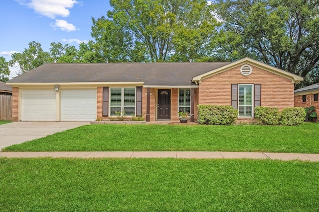 ranch-style house with a garage and a front yard