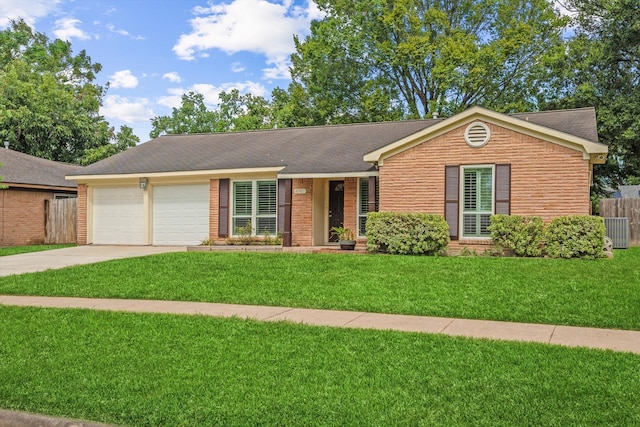 ranch-style house with a front yard and a garage