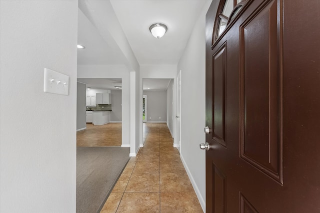 hallway with light tile patterned floors