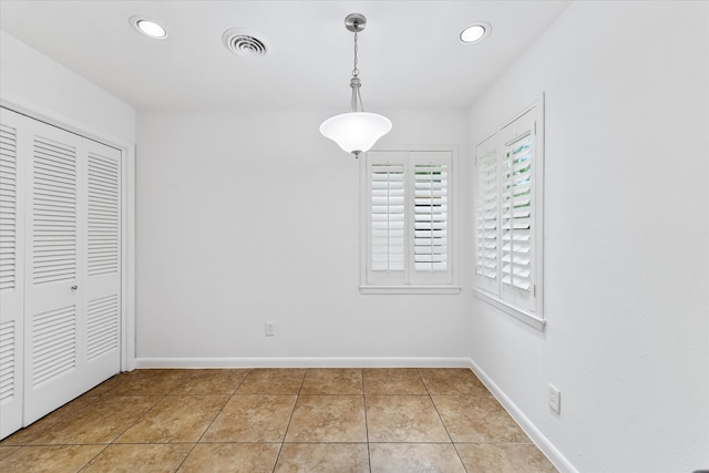 unfurnished bedroom with light tile patterned floors