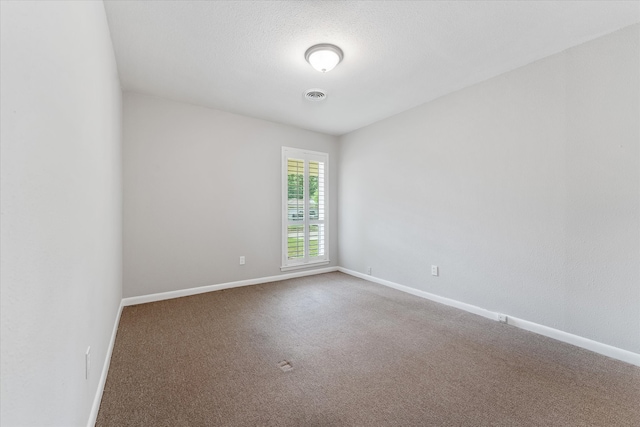 unfurnished room with carpet