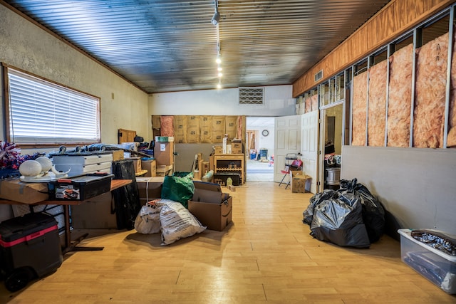 basement featuring light hardwood / wood-style flooring