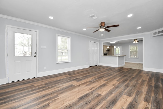 unfurnished living room featuring ceiling fan, hardwood / wood-style flooring, and crown molding