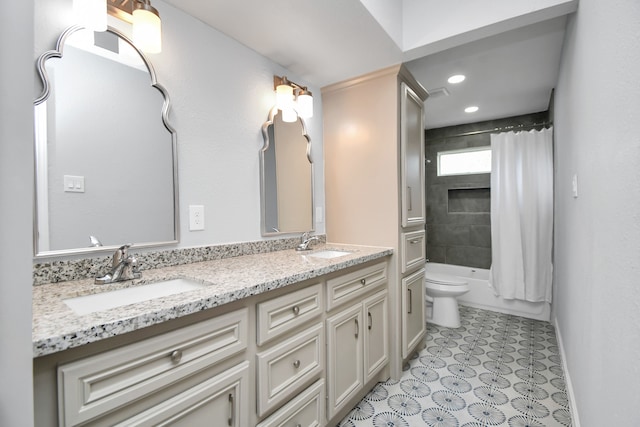 bathroom with toilet, double vanity, and tile patterned flooring