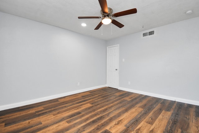 empty room featuring hardwood / wood-style flooring and ceiling fan