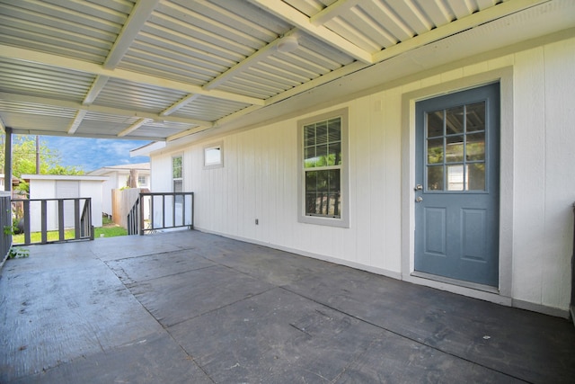 view of patio featuring a shed