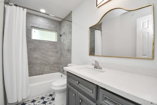 full bathroom featuring tile patterned floors, vanity, shower / tub combo with curtain, and toilet