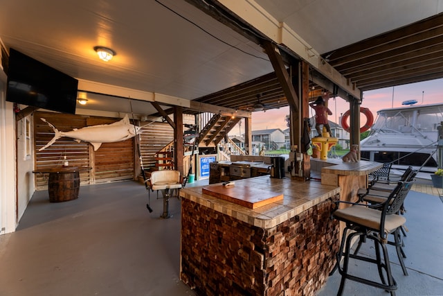 patio terrace at dusk with exterior bar