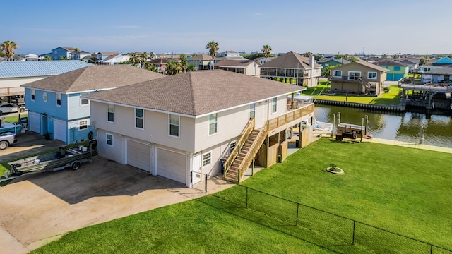 bird's eye view featuring a residential view and a water view