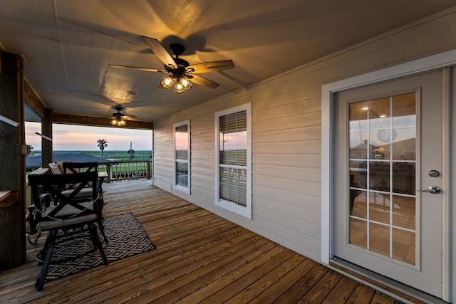 deck at dusk with ceiling fan