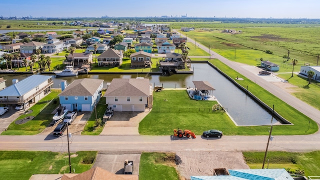 bird's eye view with a water view and a residential view