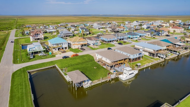 bird's eye view with a water view and a residential view