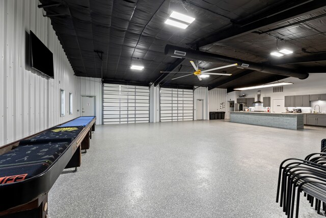 garage featuring metal wall and a sink