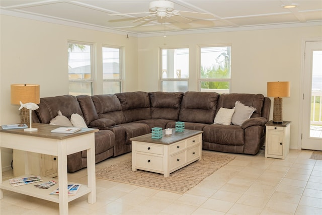 living area with ceiling fan, ornamental molding, and coffered ceiling