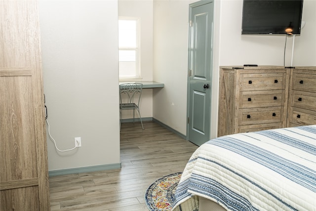 bedroom with light wood-type flooring