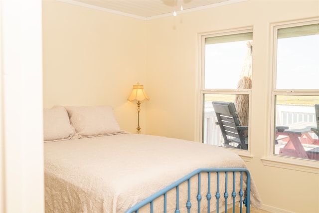 bedroom with ornamental molding